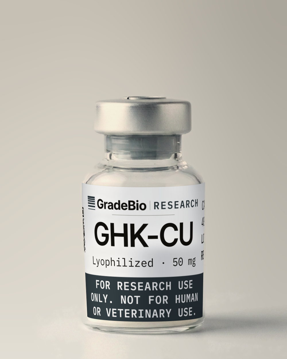 GHK-Cu as supplied — Lyophilized, 50 mg, blue to blue-violet lyophilized solid, in a 5 mL vial with an aluminum crimp seal, the label facing the camera.
