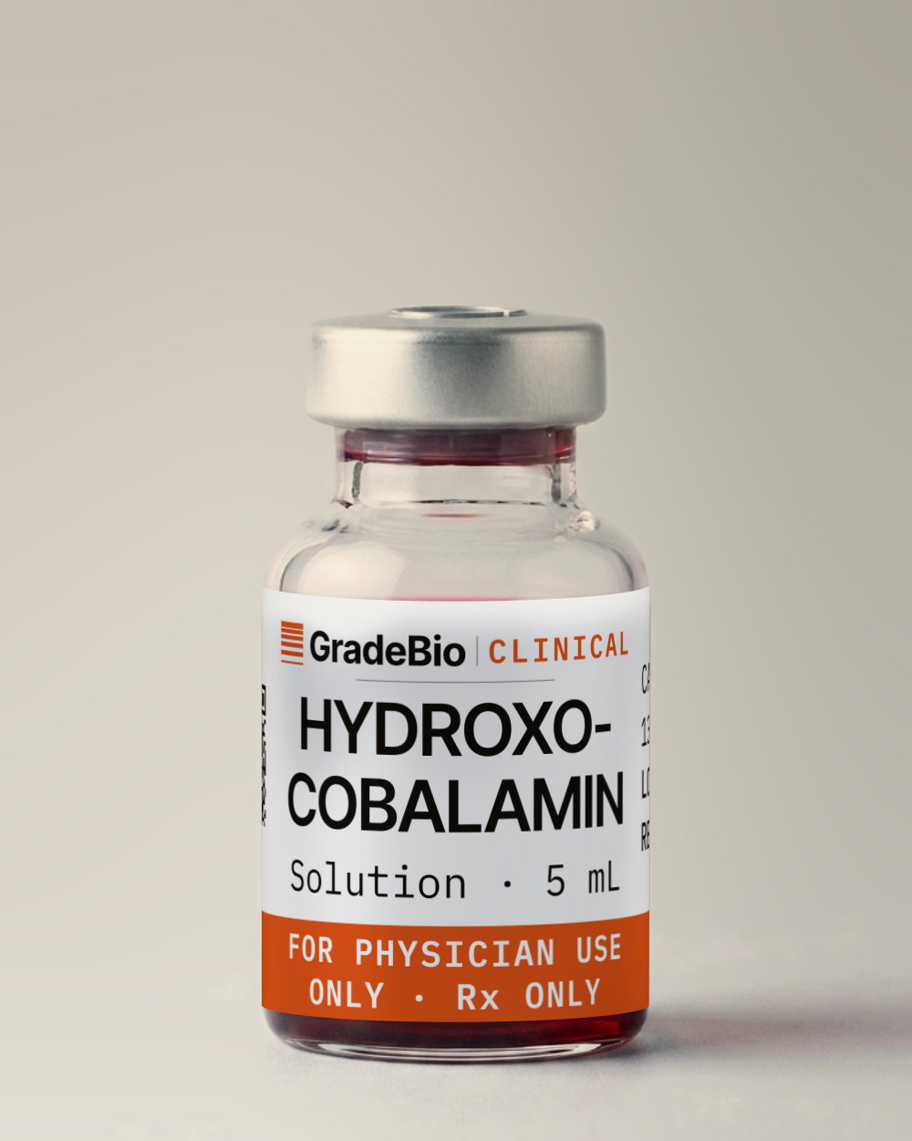 Hydroxocobalamin as supplied — Solution, 1 mg/mL, clear, deep red solution, free of visible particulate, in a 5 mL vial with an aluminum crimp seal, the label facing the camera.