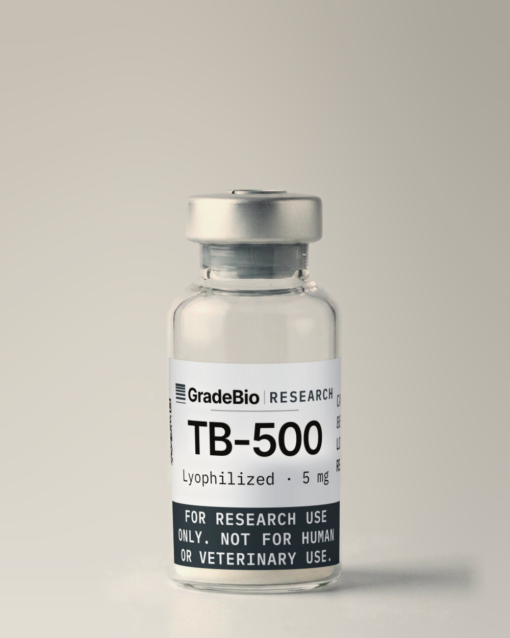 TB-500 as supplied — Lyophilized, 5 mg, white to off-white lyophilized cake, in a 2 mL vial with an aluminum crimp seal, the label facing the camera.