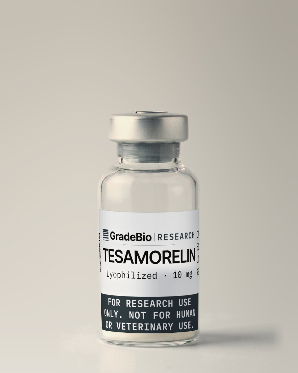 Tesamorelin as supplied — Lyophilized, 10 mg, white to off-white lyophilized cake, in a 2 mL vial with an aluminum crimp seal, the label facing the camera.